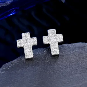Detailed macro view of micro-paved zircon cross stud earrings with fine craftsmanship