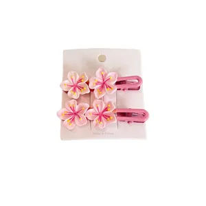 Delicate pink cherry blossom sakura hair clip set with 2 pieces on a white display card