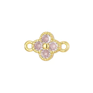 Detail of gold-plated clover jewelry connector with pink zirconia for DIY necklaces