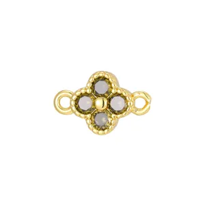 Detailed view of gold-plated four-leaf clover charm with dark zircons for DIY
