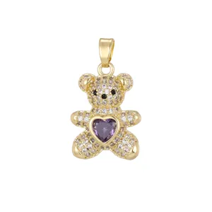 Detailed view of golden bear pendant with purple heart stone and micro-pave zircons.