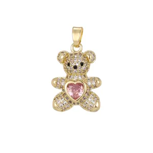 Detailed view of a gold-plated teddy bear pendant with micro-pave zircons and pink heart stone