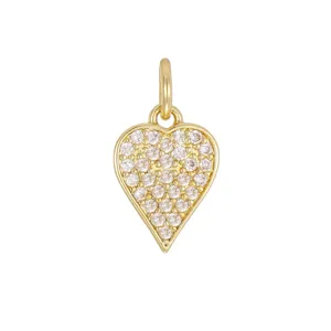 Detailed macro view of a 18K gold-plated heart pendant inlaid with cubic zirconia