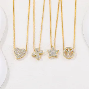 Detailed view of four gold-plated necklaces with cubic zirconia heart and star pendants.