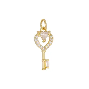 Close-up of 18K gold plated heart key pendant with sparkling clear zirconia settings