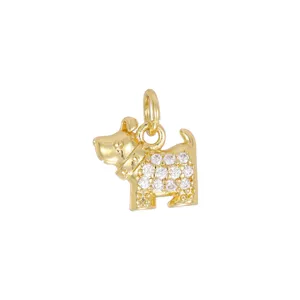 Close-up macro view of a 18K gold plated Scottie dog charm with cubic zirconia