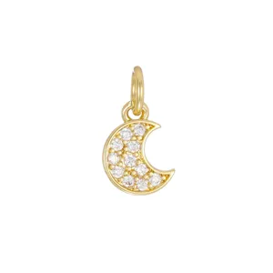 Macro detail of 18K gold plated crescent moon pendant with micro-pave cubic zirconia