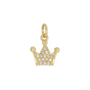 Detailed view of a 18K gold-plated crown pendant charm with sparkling cubic zirconia stones