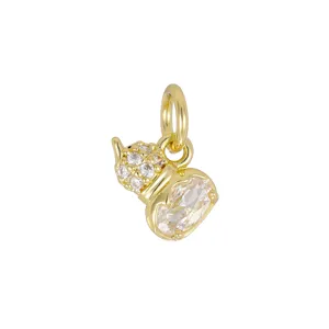 Close-up detail of an 18K gold-plated mini pendant set with sparkling cubic zirconia