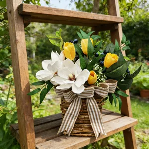 Detailed view of artificial magnolia and tulip flower arrangement in a rustic basket