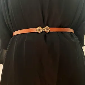 Women thin leather belt vintage metal knot buckle waist strap dress accessory stylish chic.