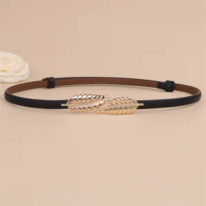 Elegant slim black leather belt with gold leaf buckle, perfect for dresses and coats.