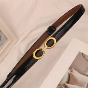 Slim black patent leather women belt with stylish gold double buckle for dresses and jeans