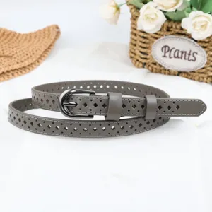 Detailed view of grey hollow women leather belt with metal buckle, casual fashion accessory.