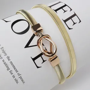 Gold metal stretch belt for women, skinny elastic waist belt with metal knot buckle.
