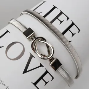 Silver elastic metal waist belt with teardrop buckle, stylish accessory for dresses and outfits.