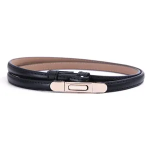 Close-up detail of a slim black leather belt featuring a sleek metallic buckle for women.