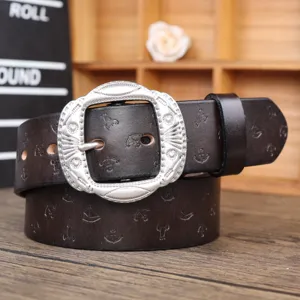 Vintage brown leather belt for women featuring ornate silver buckle and debossed anchor patterns.