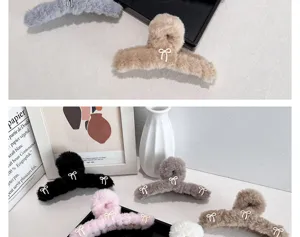 Detail shot of various colored plush hair claws with cute bow accents for styling