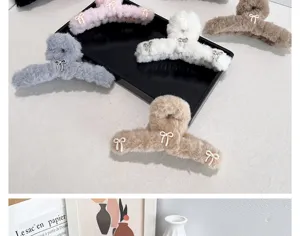 Detail of ballet-core plush hair claw clips featuring cute bow decorations in neutral tones