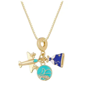 Detailed macro view of gold-plated airplane and star dress charms with blue enamel