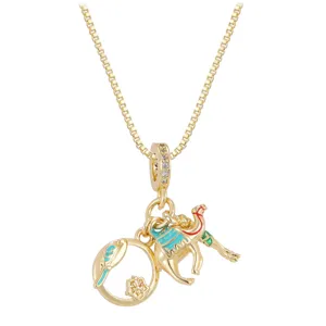 Detail of gold-plated camel and bird charms with colorful enamel on a box chain