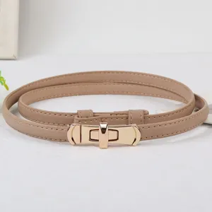 Close-up of women thin beige leather belt featuring elegant gold metal lock clasp detail.