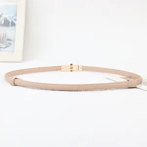 Close-up details of the slim women waist belt featuring a chic metal lock buckle.