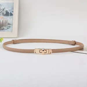 Elegant thin leather belt for women with stylish gold lock buckle, perfect for dresses.