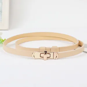 Minimalistische smalle damesceintuur met gouden draaisluiting voor elegante jurken.