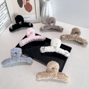 Large plush balletcore hair claw clips with sweet bow details in assorted colors