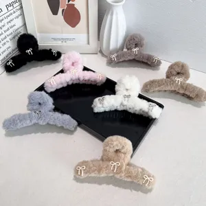 Large plush balletcore hair claw clips with bow accents in various soft colors