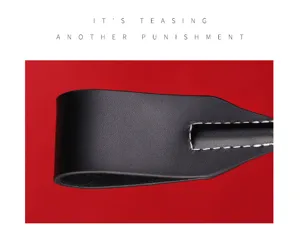 Black leather paddle whip with white stitching detail for adult sensual play and fun.