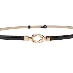 Women's black thin dress belt with stylish gold knot metal buckle for chic daily outfits.