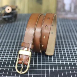 Slim brown genuine cowhide leather belt for women, featuring vintage metal pin buckle.