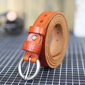 Close-up detail of a brown genuine leather women belt with star cutouts and a round metal buckle.