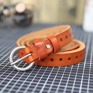 Brown leather belt detail, stylish star cutouts and round metal buckle for casual wear.