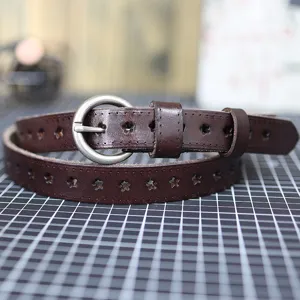 Women brown genuine leather belt with star cutouts and round metal buckle detail.