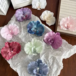 Large artificial orchid flower hair clips in various colors for elegant hair styling