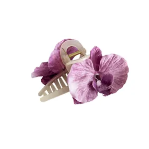 Elegant purple pleated orchid flower hair claw clip made of ethereal silk fabric for women