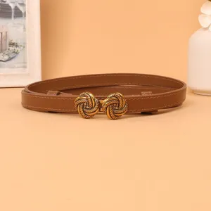 Brown women thin leather belt with vintage metal knot buckle detailed view for daily fashion wear.