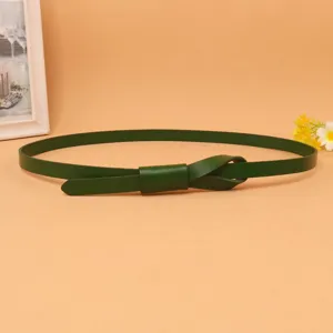 Detailed view of dark green slim cowhide belt with elegant knot buckle for dresses.