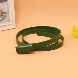 Detail view of a high-quality slim dark green leather belt for women's dresses
