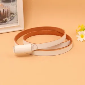 Close-up view of a minimalist white leather slim belt for women's dress waist decoration