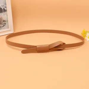 Close-up of a skinny brown leather belt for women featuring an elegant knot design.