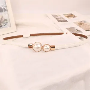 Detailed view of an elegant thin white belt featuring a stylish double pearl buckle.