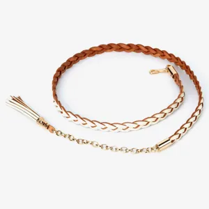 Detail shot of the braided leather waist chain with tassel and gold metal hardware and hook.