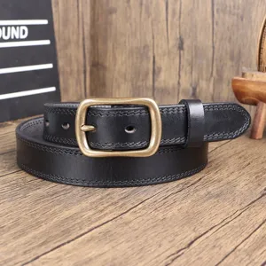 Detailed view of black genuine leather belt with antique metal buckle and stitching.