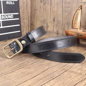 Detailed view of black genuine cowhide leather belt with retro brass metal buckle and stitching.