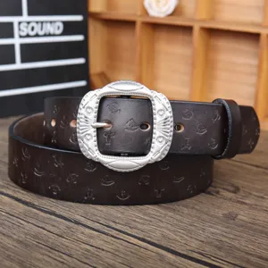 Vintage brown leather belt with anchor sailboat embossing and ornate silver metal buckle.